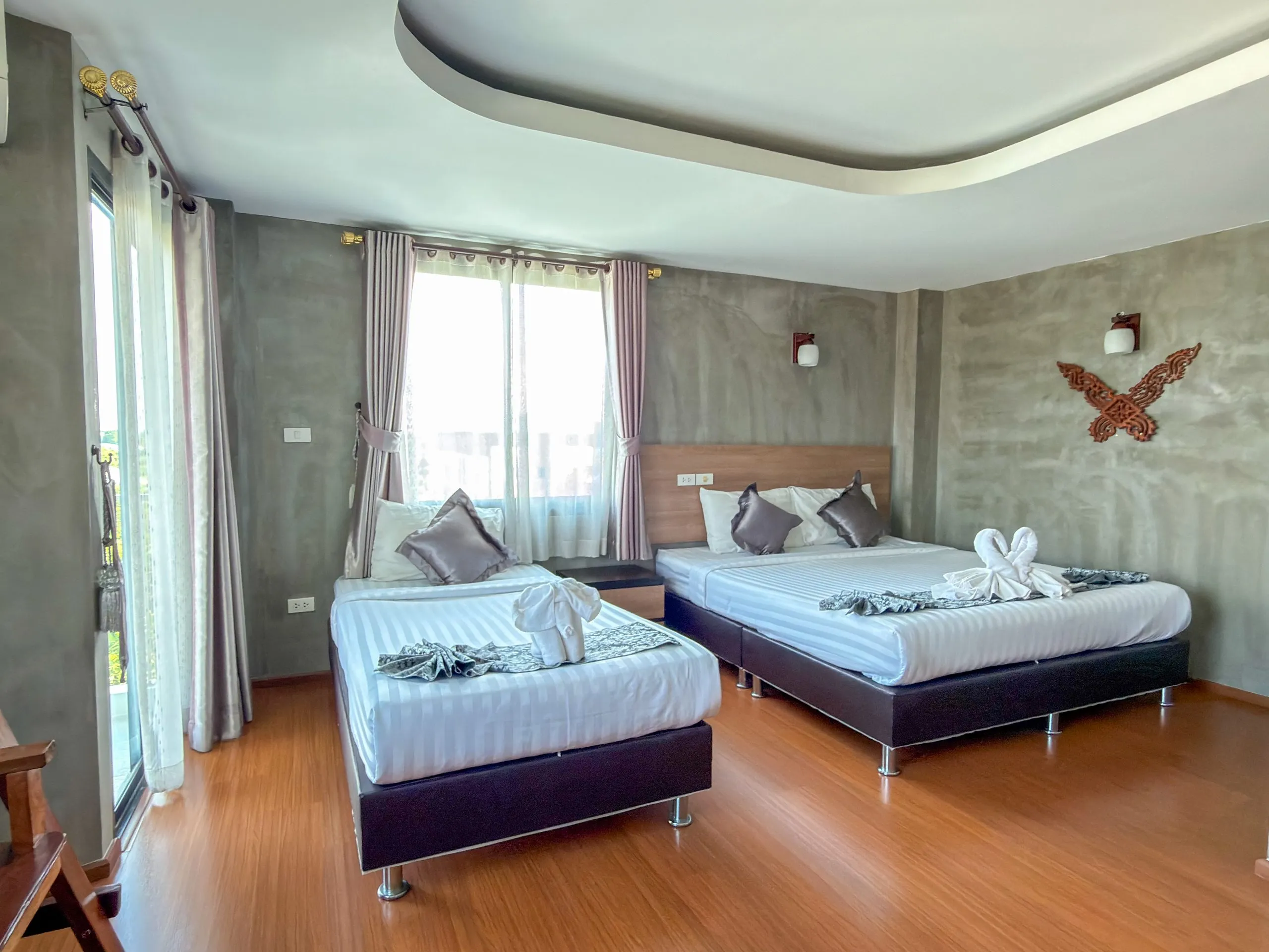 Studio room with two beds and a window