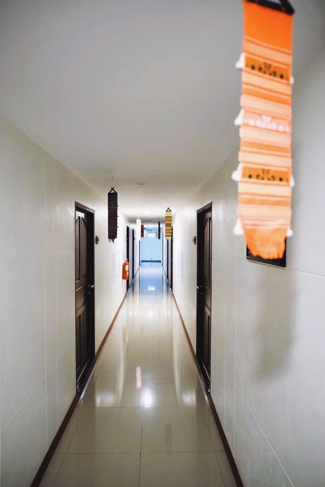 Corridor inside the hotel, with room doors on either side