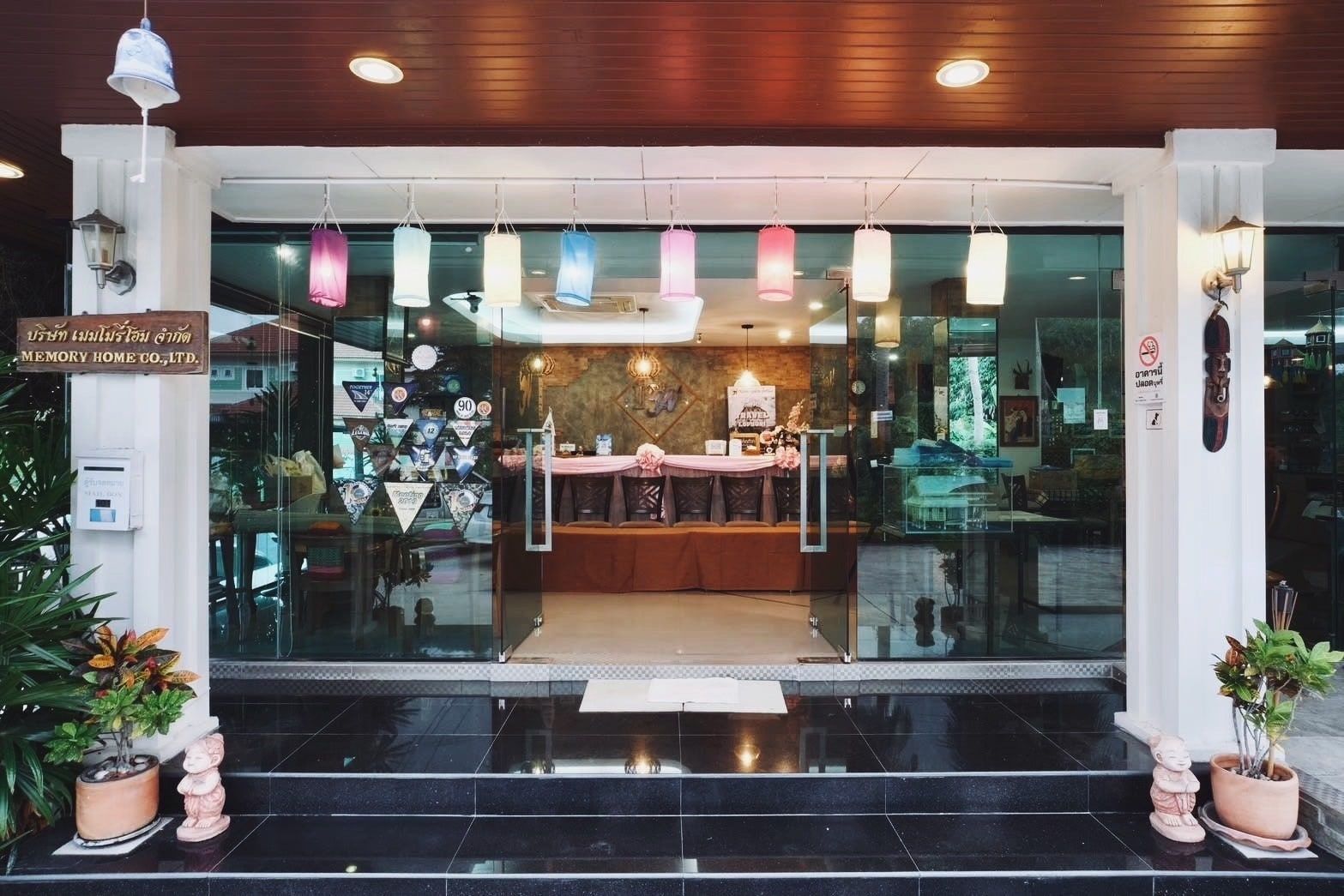 Hotel entrance by day, seen through the glass doors